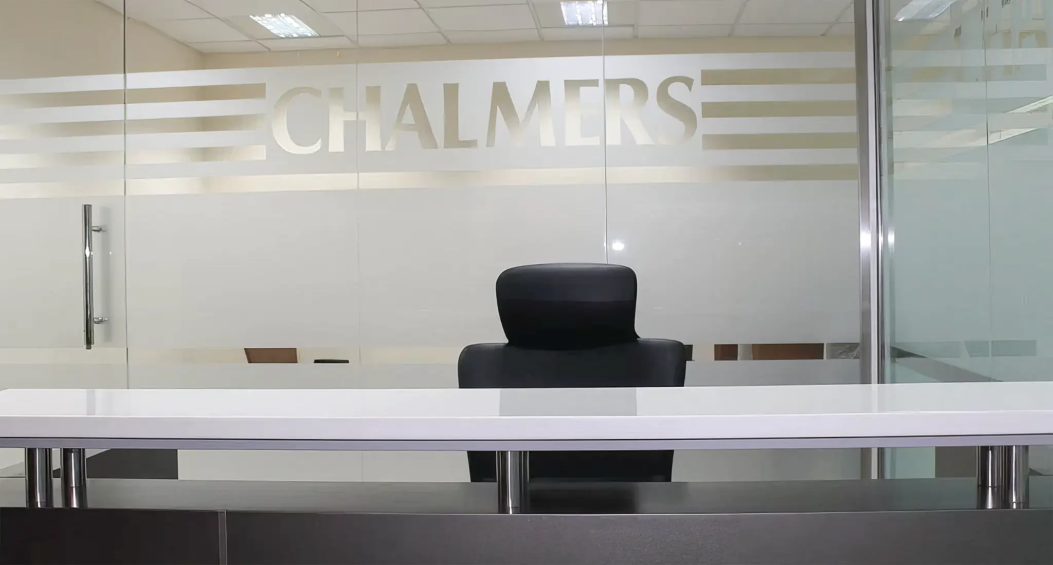 CHALMERS ENGINEERING CO. (L.L.C.)'s office features cubicles and desks for a productive work environment.